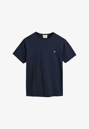 T-shirt in cotone blu navy con maniche corte, collo tondo e piccolo logo ricamato sul petto. Texture liscia, vestibilità classica, design minimale.