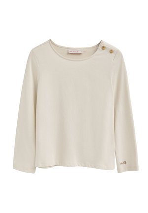 Maglia a maniche lunghe color crema realizzata in tessuto morbido con scollatura rotonda, caratterizzata da due bottoni decorativi su una spalla e logo ricamato sotto.