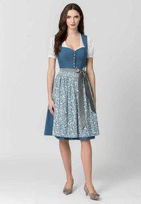 Blue polka-dot dirndl with white blouse, floral-patterned skirt, gray sash, and buttons down the front. Modest neckline and flared hem.