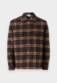 Brown and black plaid flannel shirt featuring a button-down front, two chest pockets, and a collar. Soft texture and relaxed fit.