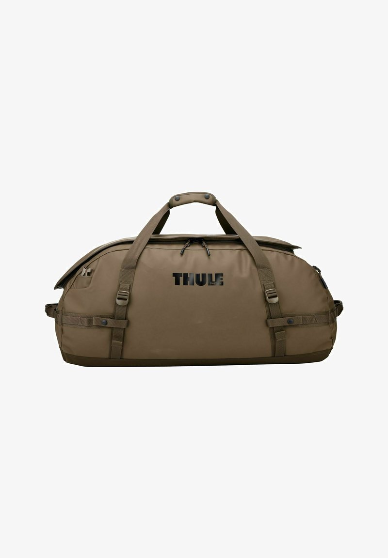 Grand sac de sport marron Thule avec double poignée, sangles latérales et compartiment principal zippé.