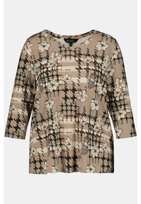 Beige blus med blommönster och trekvartsärmar. Har en rutigt mönster med svarta och orange accenter. Slät tygtextur.