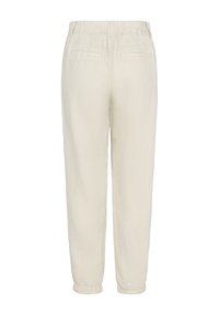 Light beige linen trousers with an elastic waistband, side pockets, and tapered cuffs. Smooth texture with a simple, unembellished design.