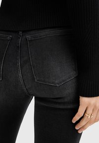 AllSaints HALDAN - Bootcut-farkut - black