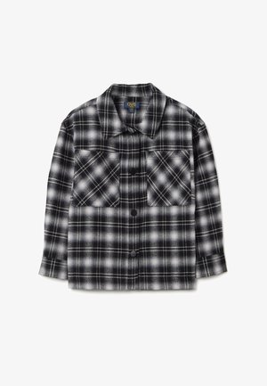 Schwarz-weißer kariertes Flanellhemd mit zwei Brusttaschen, Knopfleiste und langen Ärmeln, aus einem weichen, strukturierten Stoff.