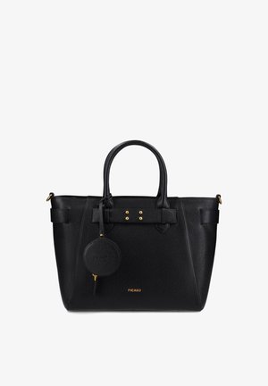 Sac fourre-tout en cuir noir avec quincaillerie dorée, forme structurée, deux poignées, sangles décoratives et une pochette ronde attachée pour les pièces.