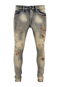 Tette jeans i falmet blå denim med slitte detaljer. Har flerfargede malingssprut-aksenter på foran, femlommers design og beltehemper.