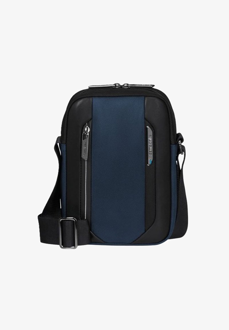Borsa a tracolla compatta in blu navy e nero, con tracolla regolabile, tasche frontali con zip e zip in metallo argentato.