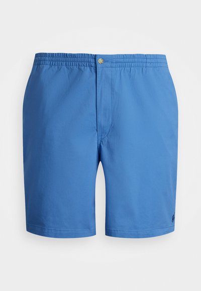 Des shorts de bain bleus avec une taille élastique dotée d'un bouton, une texture lisse et un logo en bas à droite de la jambe.