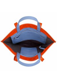 Tote bag featuring orange exterior and light blue interior, made of smooth leather. Includes a zipper pocket and a side compartment.