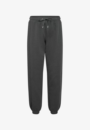 Mørkegrå joggingbukser lavet af blødt materiale, med en elastisk talje og justerbar snor samt tapered ankler.
