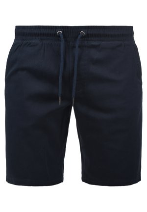 Tumedad sinised lühikesed püksid, mis on valmistatud kerge materjali ja elastse vöökoha ning paelaga. Ühtlane tekstuur, ilma mustrite ja tarvikuteta.