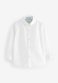 Chemise blanche à manches longues en coton avec col pointu, fermeture à boutons et quatre accents de boutons transparents sur la patte de boutonnage.