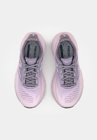 Light pink and lavender athletic shoes with breathable mesh upper, padded collar, and textured outsole design. Features reflective accents.