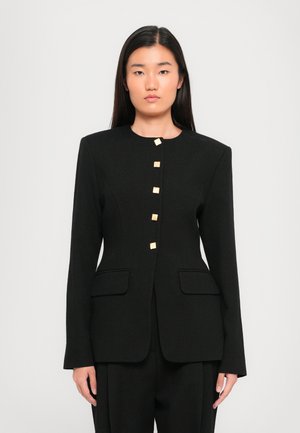 Black tailored blazer featuring a round neckline, front pockets, and five square gold-tone buttons for closure. Smooth texture and structured fit.