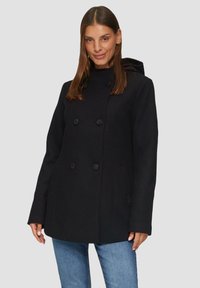Zwarte dubbelgeknoopte jas met hoge kraag en capuchon, voorzien van grote knopen en zijzakken. Gemaakt van textuurstof.