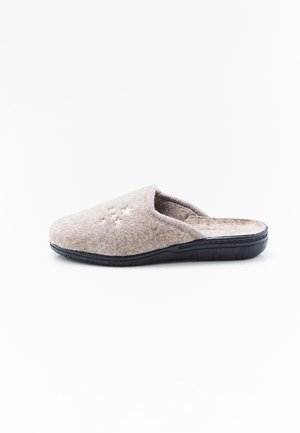 Zapatilla beige de fieltro con suela negra, parte trasera abierta y pequeño bordado en forma de estrella en la parte superior.