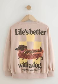Light pink sweatshirt featuring a cartoon dachshund on a hot dog and text reading "Life's better with a dog". Ribbed cuffs and hem.