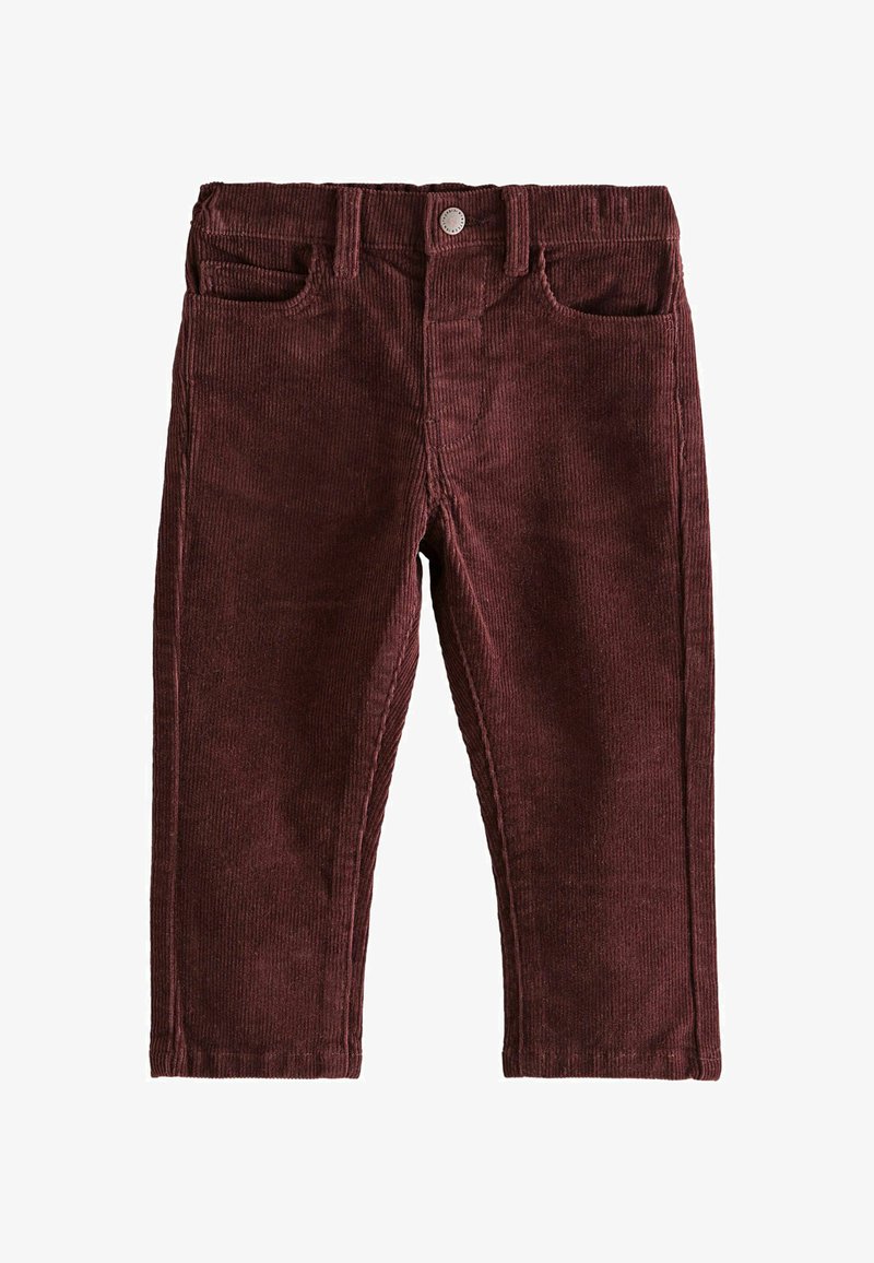 Pantalon en velours côtelé bordeaux avec une taille à passants de ceinture, poches avant et texture de côtes verticales visibles.