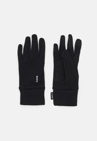 Gants noirs en tissu extensible, dotés d'une surface texturée sur les paumes et d'un ajustement serré au niveau des poignets. Logo de la marque sur le côté.
