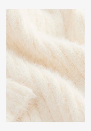 Kremowa dzianina o miękkiej, puszystej fakturze i prążkowanym wzorze, prezentująca lekkie, przewiewne nitki i subtelny połysk.