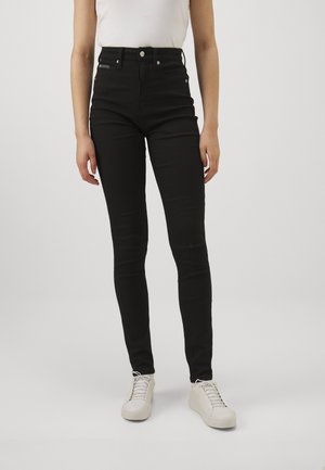 HIGH SKINNY - Kitsa lõikega teksad - denim black