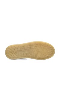 Rubber shoe sole in beige with textured tread pattern. Wide, flat design suitable for grip and traction. Smooth edges and slight curvature.