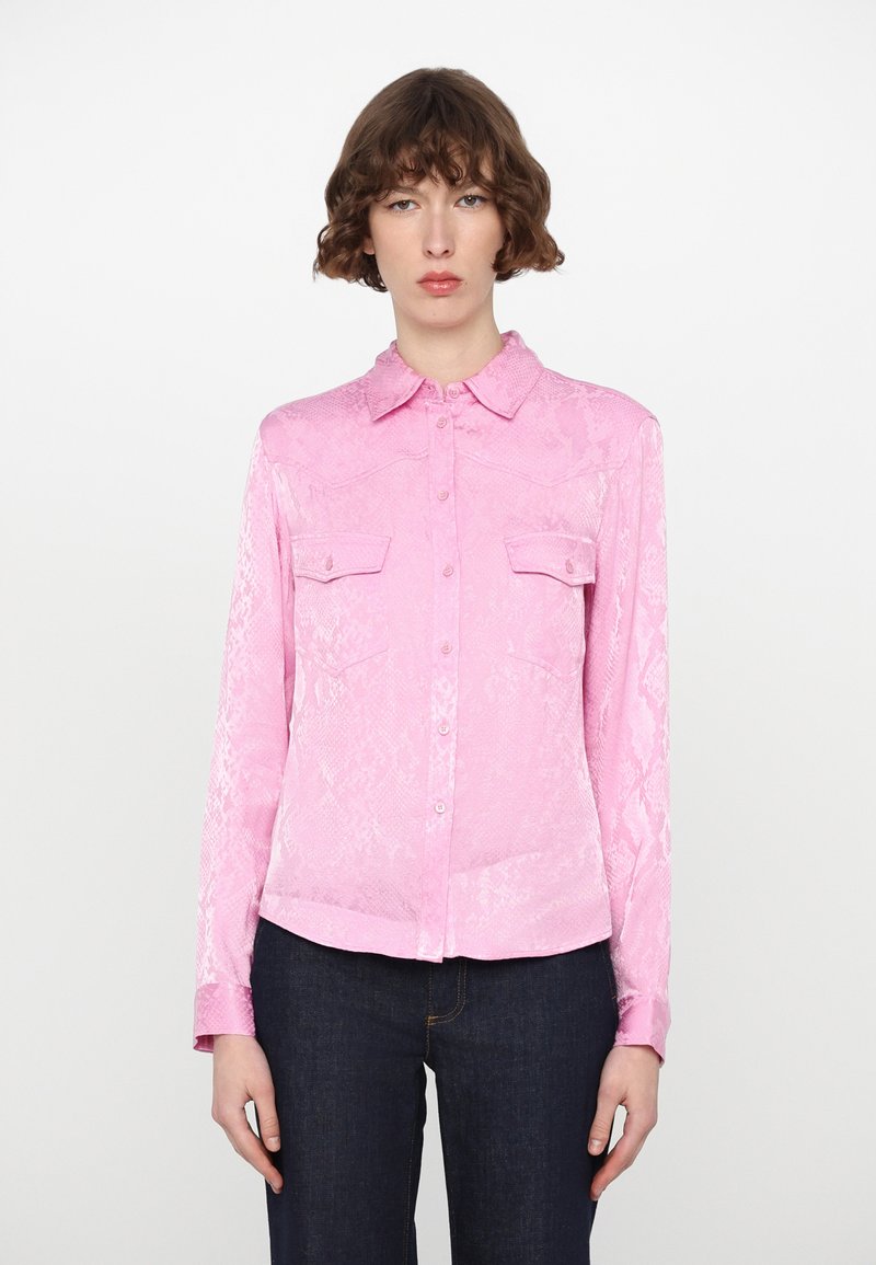 Pink snake-print shirt with a collared neckline, button front, and two chest pockets. Made from a shiny, smooth fabric; long sleeves.