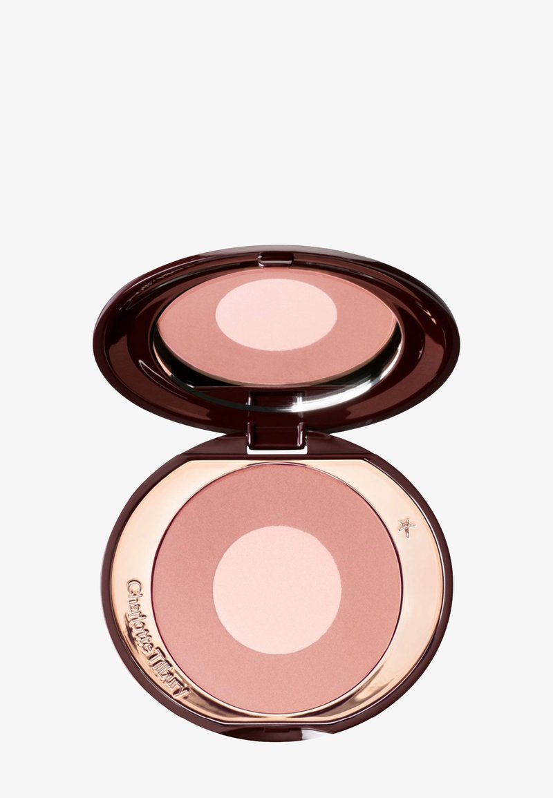 Round compact with a dark brown case. Contains a light pink circle and a peachy blush. Smooth texture with a shiny finish and gold accents.