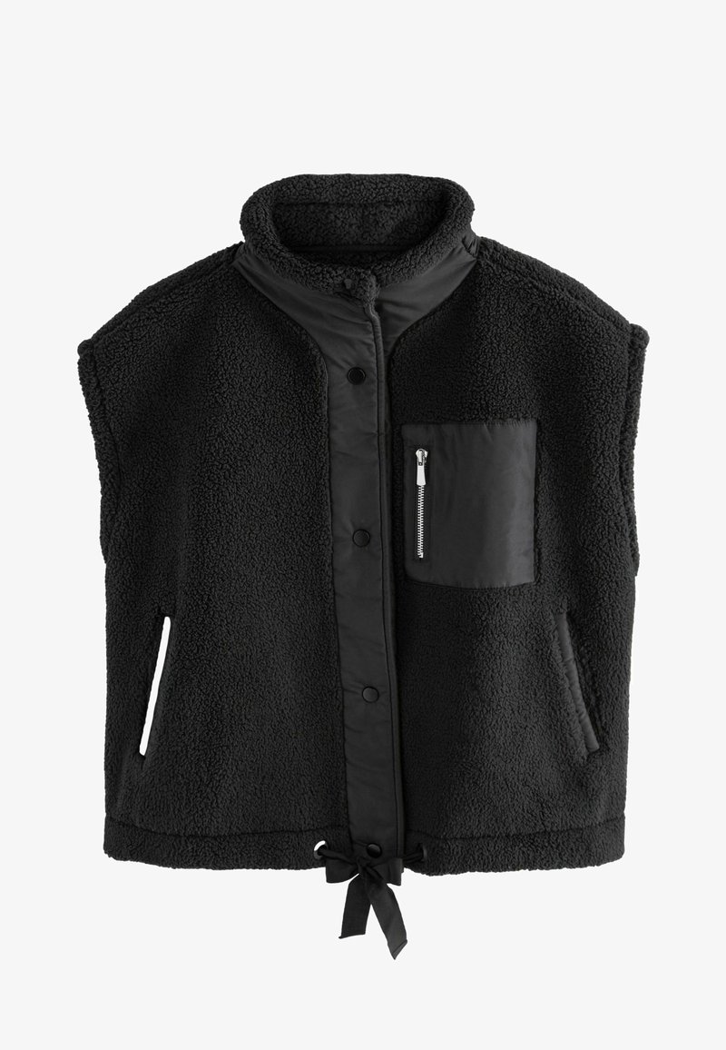 Chaleco de forro polar negro con cuello alto, botones a presión, un bolsillo en el pecho con cremallera y bolsillos laterales, con un cordón en el dobladillo.