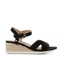 Sandali con zeppa in suede nero caratterizzati da un design incrociato, cinturino alla caviglia regolabile con fibbia e base piattaforma avvolta in juta.