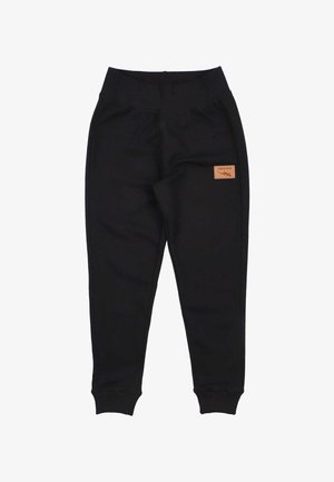Zwarte joggingsbroek van zacht materiaal, met een elastische tailleband en manchetten, en een klein leren label aan de voorkant.