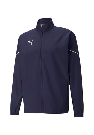 Marineblauwe windbreaker jas gemaakt van lichtgewicht stof. Voorzien van een staande kraag, ritssluiting aan de voorkant, elastische manchetten en witte logo-accenten.
