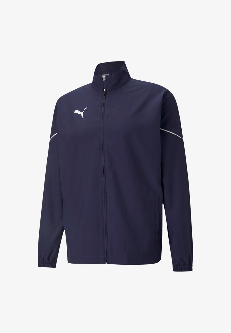 Giacca a vento blu navy realizzata in tessuto leggero. Presenta un colletto rialzato, zip frontale, polsini elasticizzati e dettagli del logo bianco.