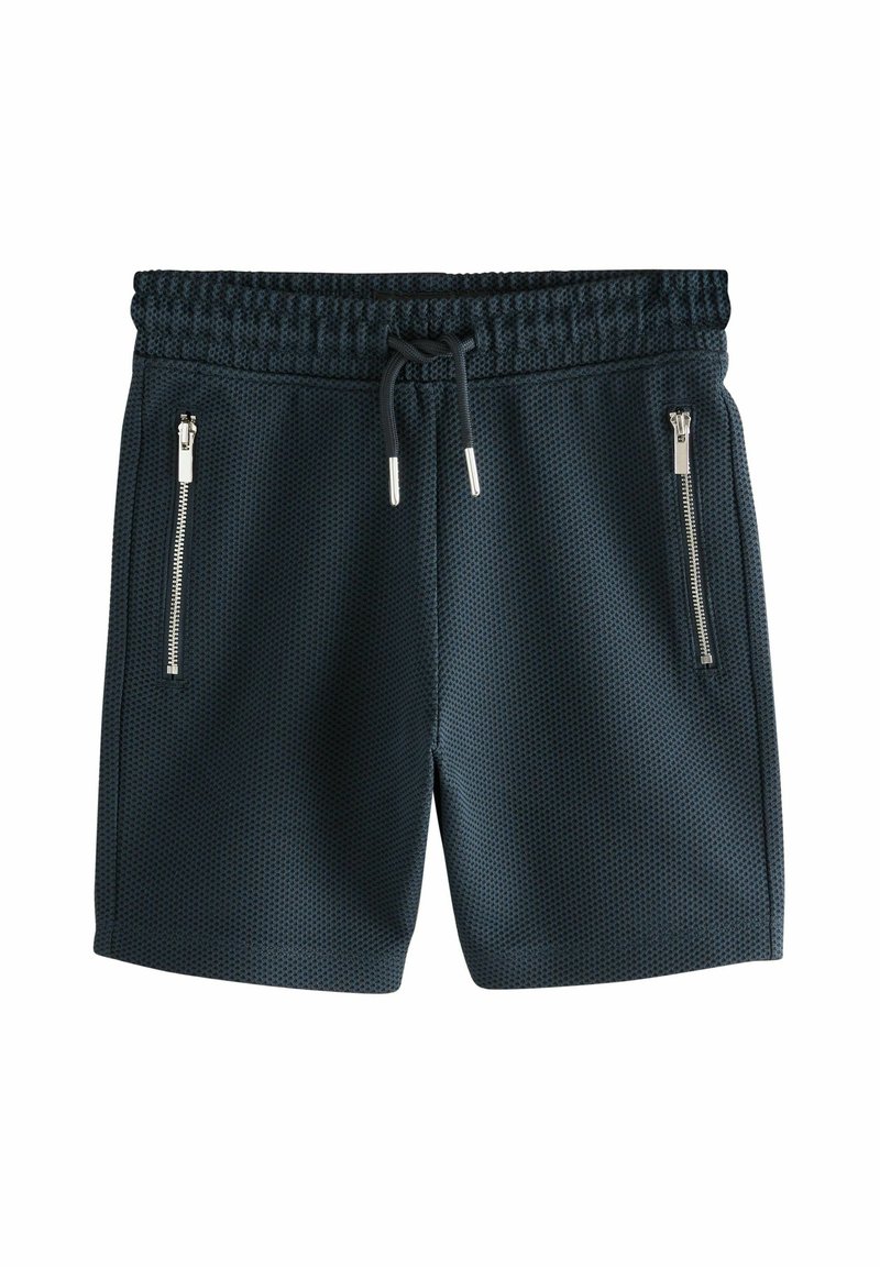 Shorts de sport bleu marine avec un motif en maille texturée, taille élastique et deux poches latérales zippées. Fermeture avec cordon de serrage incluse.