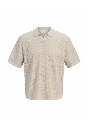 Polo beige à manches courtes avec col, motif ajouré tricoté en zigzag, et coupe légèrement ample.