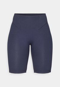 Marina blå träningsshorts med hög midja, tillverkade av mjukt, elastiskt tyg. Har subtil sömdetaljering och en figurnära design.