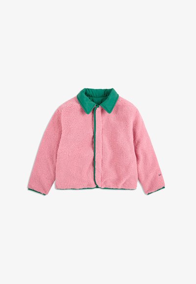 Fleece jacket in pink with a green collar. Features a buttonless front, round shape, and long sleeves. Soft texture with visible stitching.