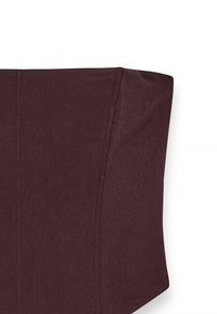 Burgundy fabric with a smooth texture, featuring structured seams and an angular shape. The design is minimalist with clean lines.