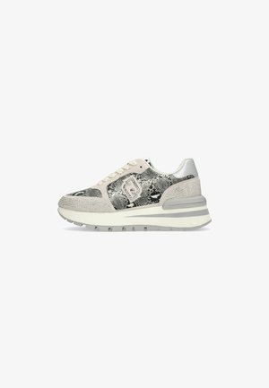 White and gray sneaker with snakeskin pattern, lace-up front, cushioned sole, and decorative studs on toe and heel areas.