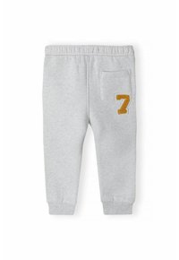 Graue Baumwoll-Sweatpants mit elastischem Bund, schmal zulaufenden Bündchen und einer Gesäßtasche. Mit einer gestickten gelben "7" am linken Oberschenkel.