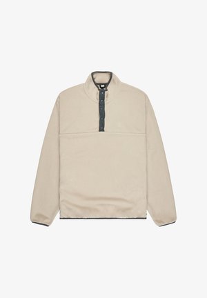 Beige fleece sweater met een halve rits, voorzien van een donkerblauwe knoopsluiting en contrasterende donkerblauwe zoom en manchetten. Subtiel logo op de borst.