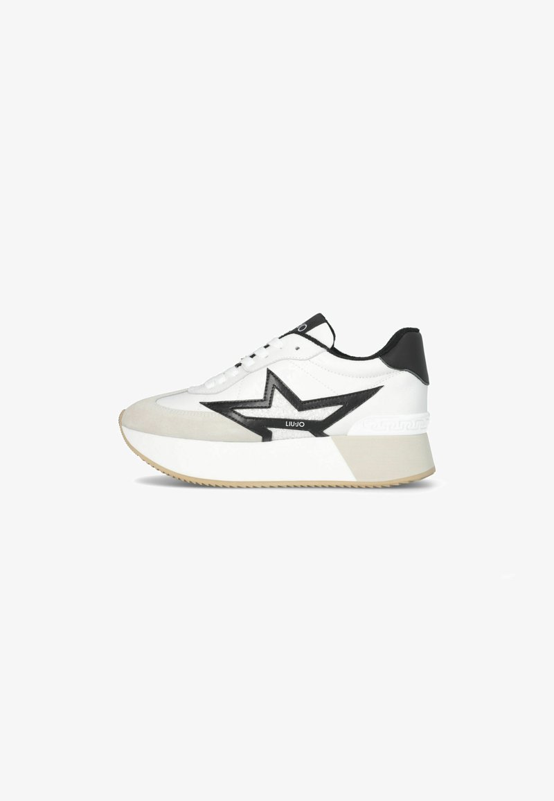 Sneaker bianco con design e dettagli neri a forma di stella, caratterizzato da una tomaia in pelle liscia, suola platform e dettagli beige strutturati.