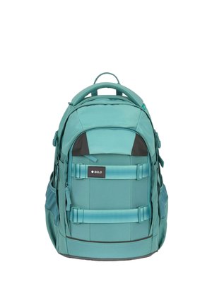 Teal backpack with multiple zippered compartments, front straps with a "BOLD" tag, side mesh pockets, and a padded top handle.