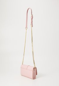 Pink leather handbag with a rectangular shape. Features a gold chain strap and a smooth texture, with a fold-over flap closure.