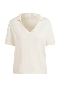 Pull en tricot à manches courtes et col en V de couleur blanc cassé. Il présente un col et un ourlet côtelés, avec un petit logo sur la poitrine gauche. Texture douce.
