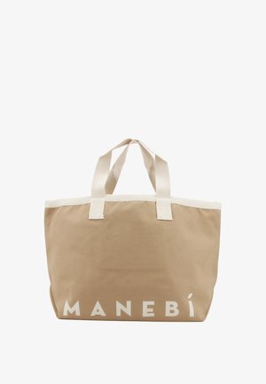 Borsa tote in tela beige con manici bianchi e la scritta "MANEBI" in lettere bianche vicino al bordo inferiore.