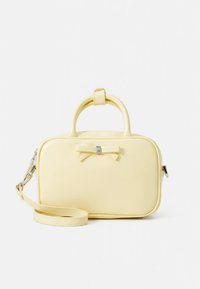 Yellow faux leather bag with a rectangular shape, top handle, and detachable strap. Features a bow accent and smooth texture.