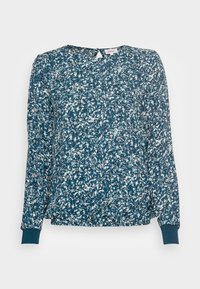 Blommig blus i teal med vita och rosa accenter. Långa ärmar med elastiska manschetter, rund halsringning och nyckelhål i ryggen.