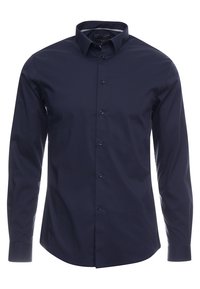 Camisa de botones de manga larga azul marino, fabricada en una mezcla de algodón, diseño liso, cuello clásico y seis botones en el frente con bajo curvado.